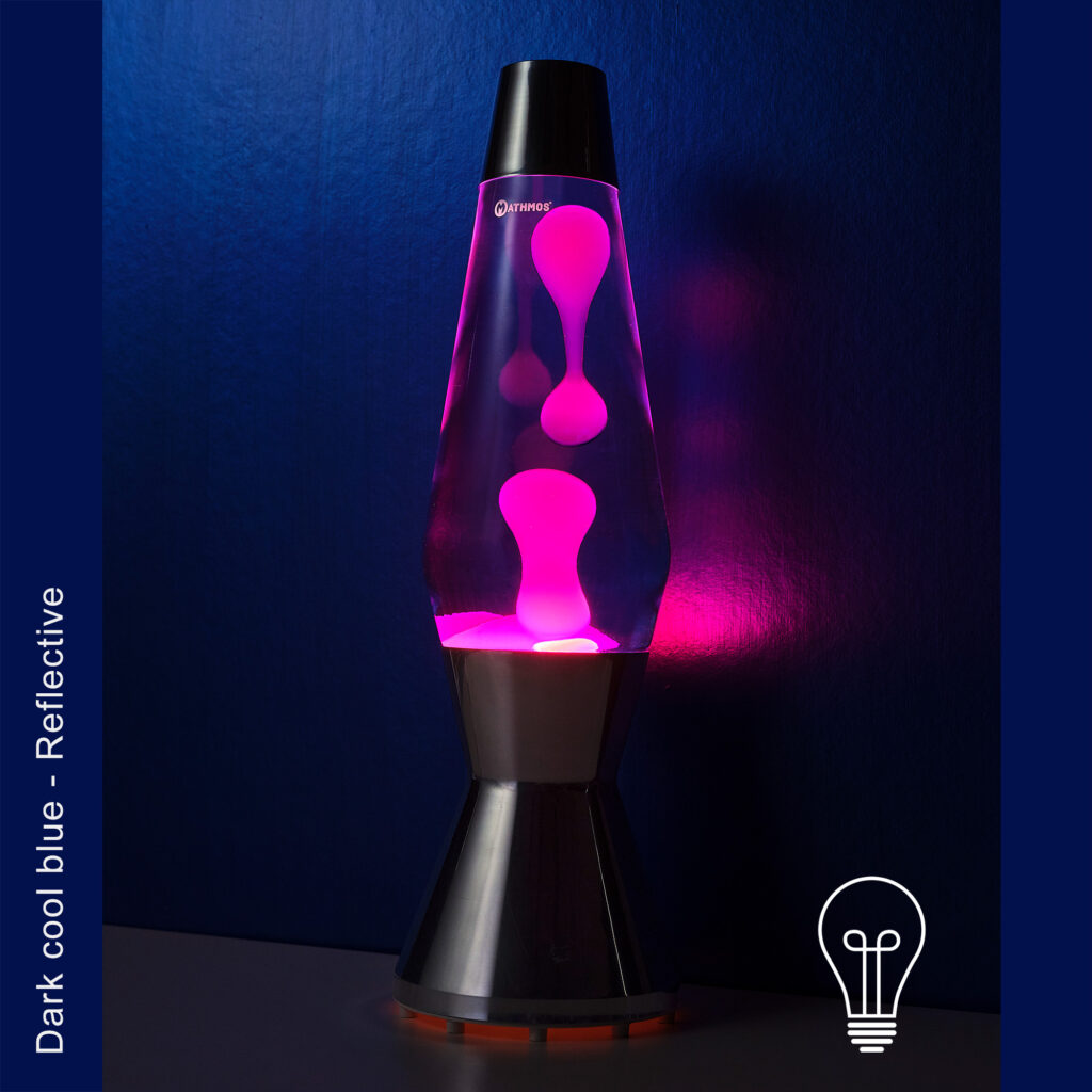 Mathmos Astro Lava lamp blue pink against dark blue background with lights off.